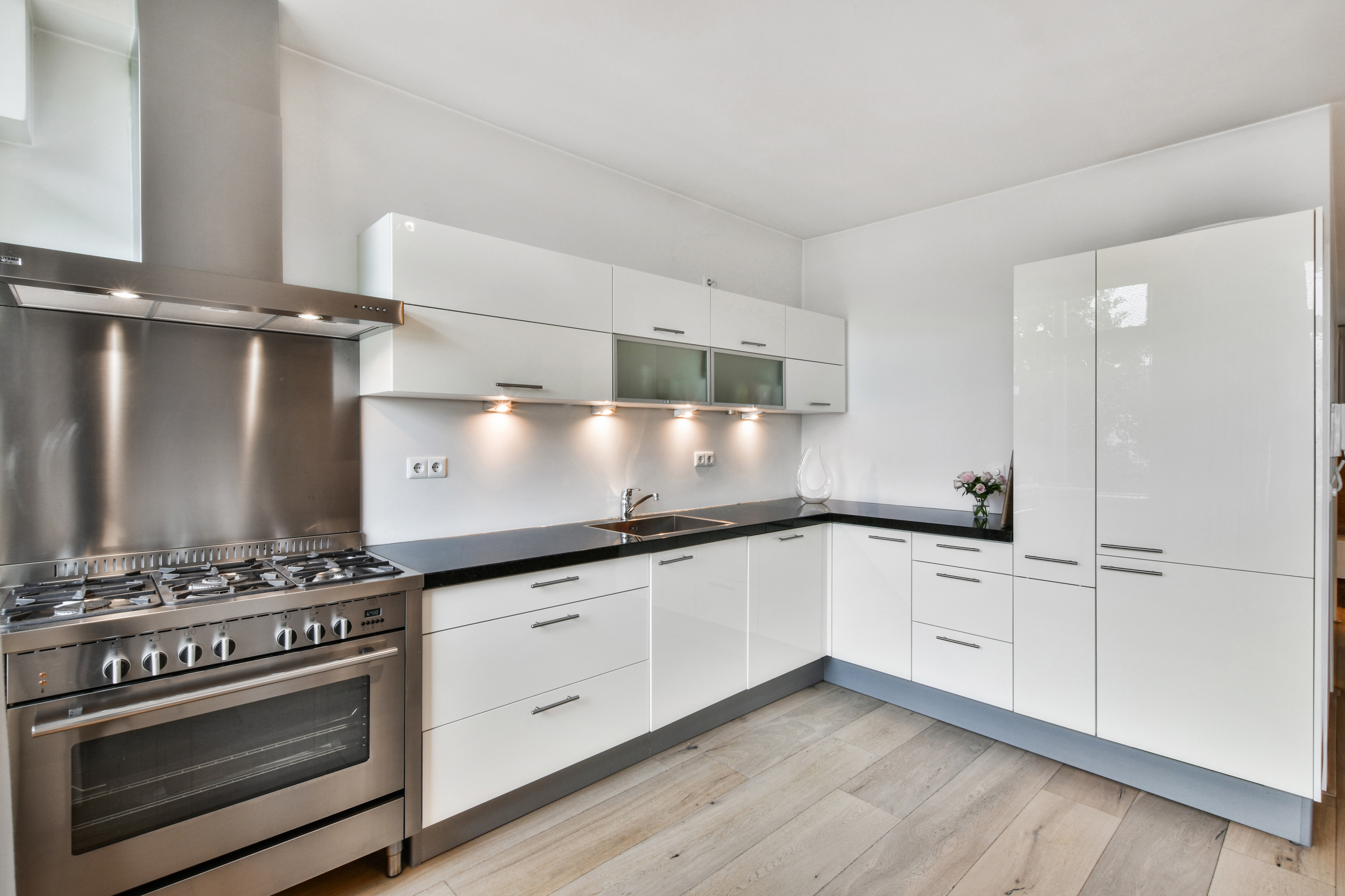 Pristine empty showroom kitchen — this is the wrong register